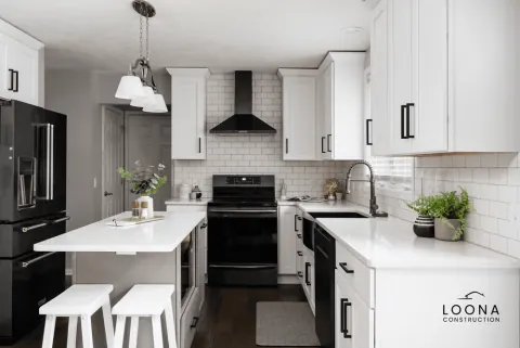 White kitchen with black island in Newark, photo 2
